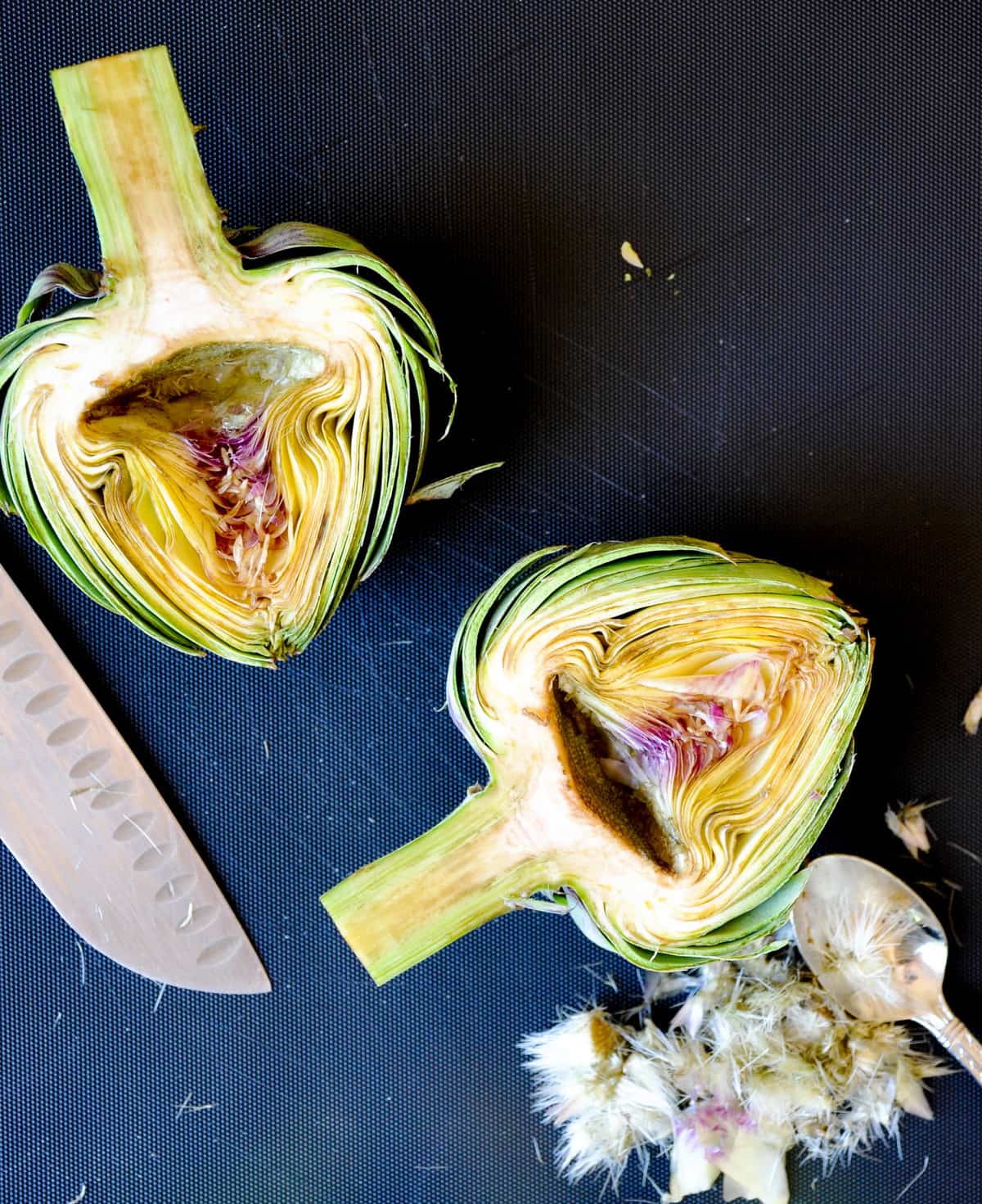 Remove the hairy part of the artichoke 