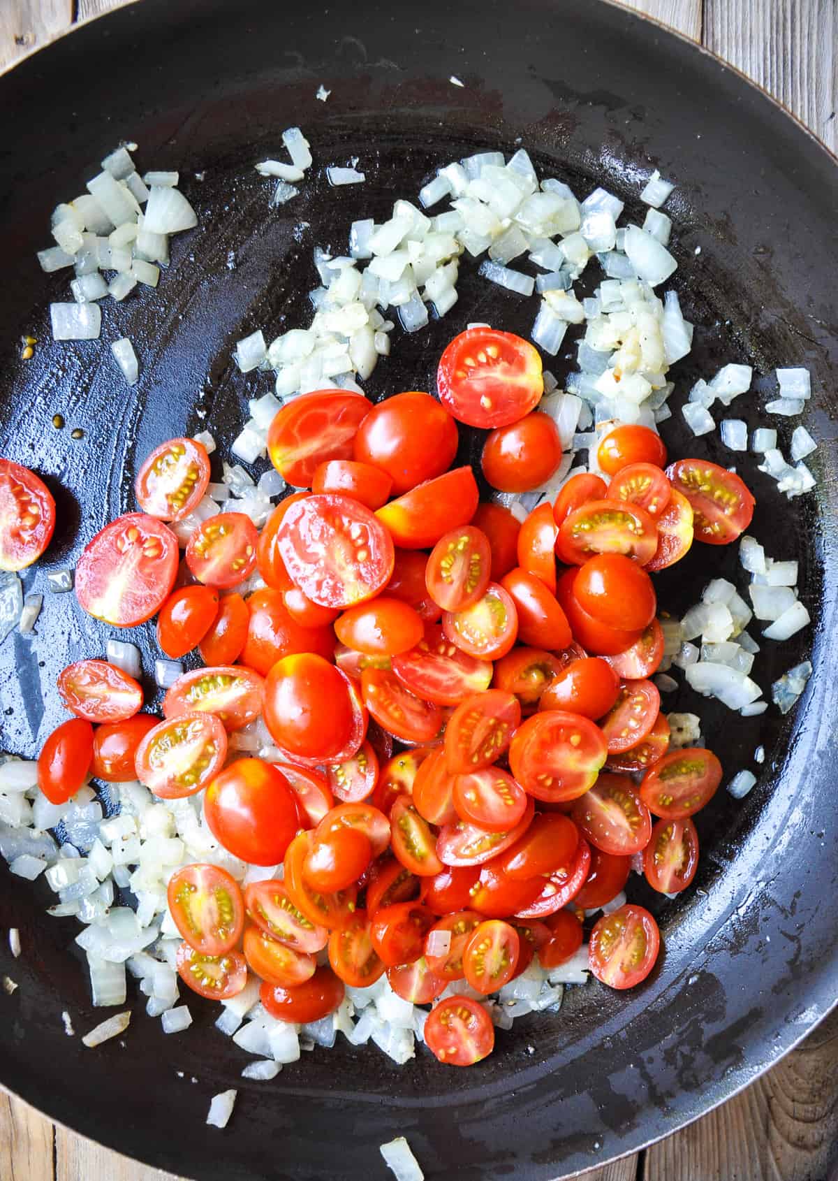 Sautee diced onion, garlic, and halved cherry tomatoes 