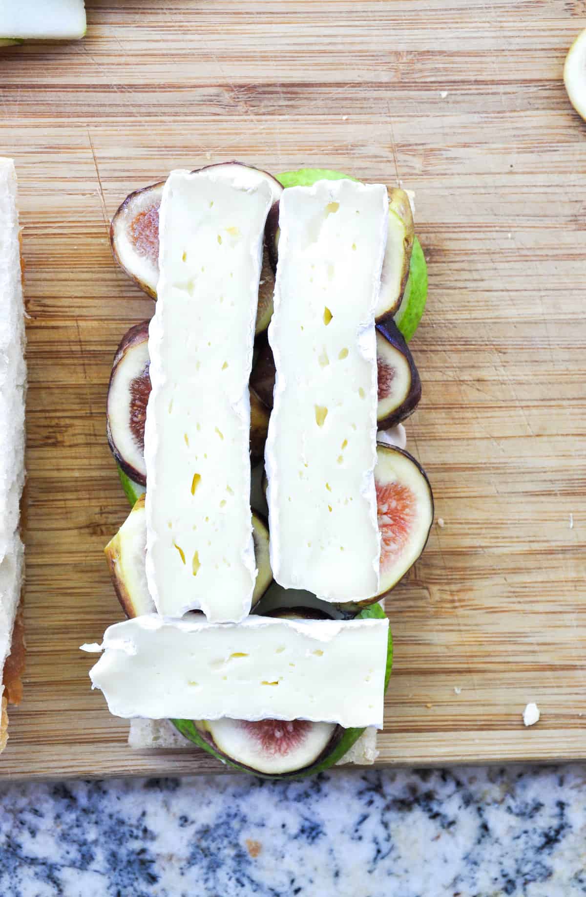 Layer sliced brie over sliced fig