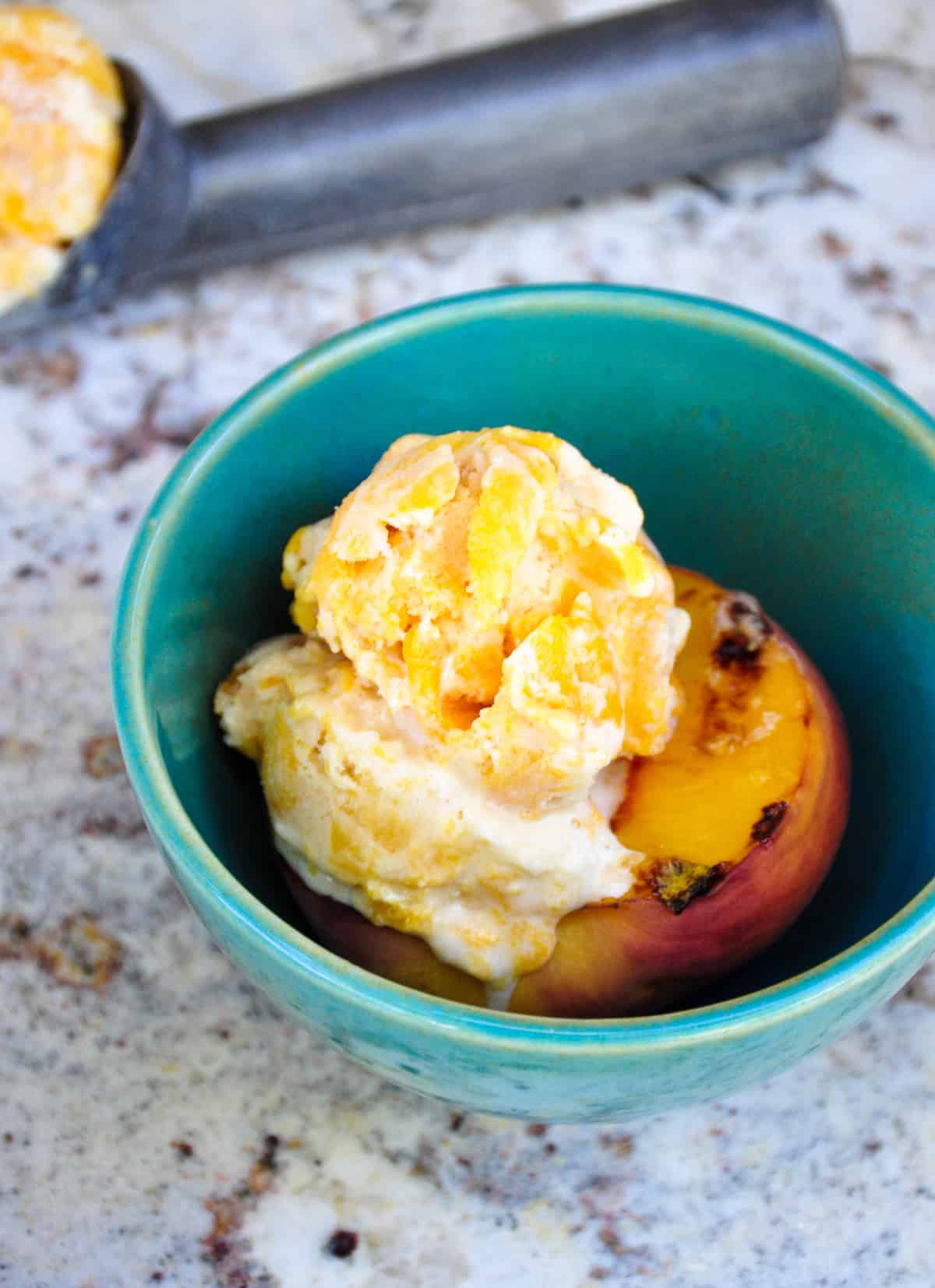 Canned Peach Ice Cream atop Fresh Grilled Peaches