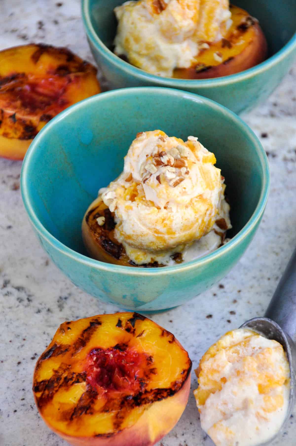 Canned Peach Ice Cream atop Fresh Grilled Peaches