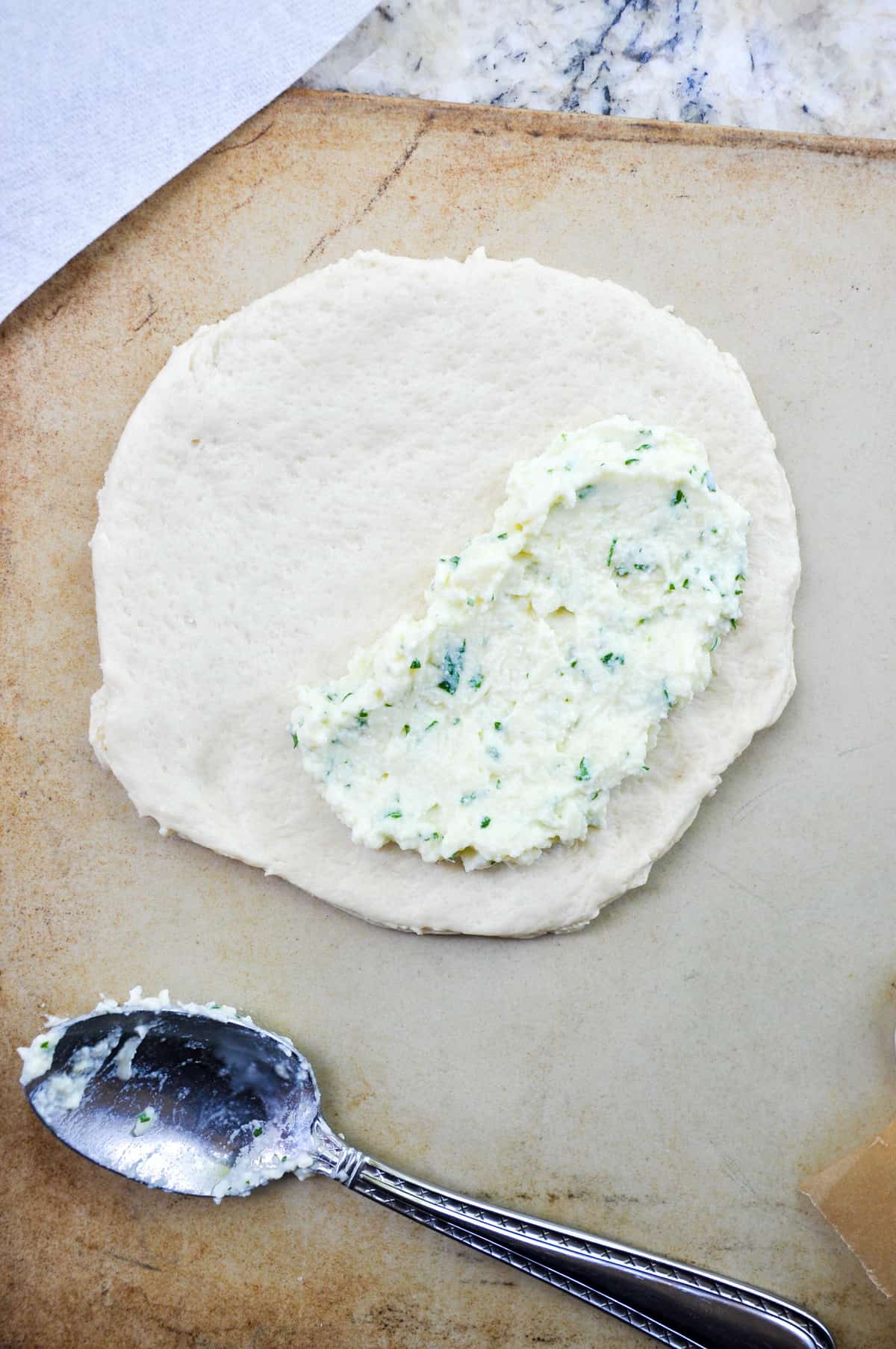 Ricotta cheese on pizza dough 