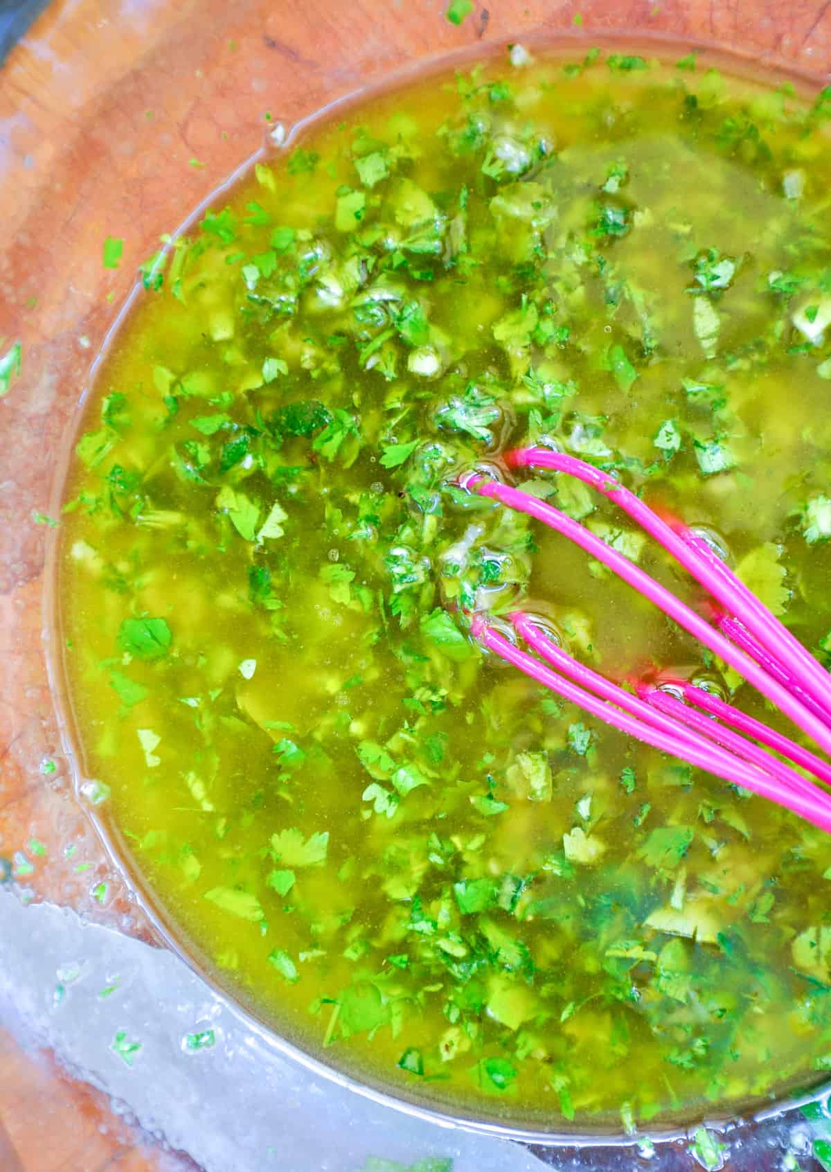 Mixing herbs with olive oil