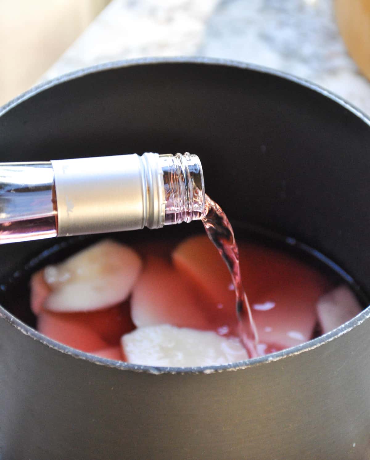 Add rose wine to saucepan 