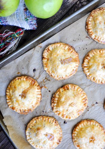 Baked Caramel Apple Hand Pies  on a baking sheet.