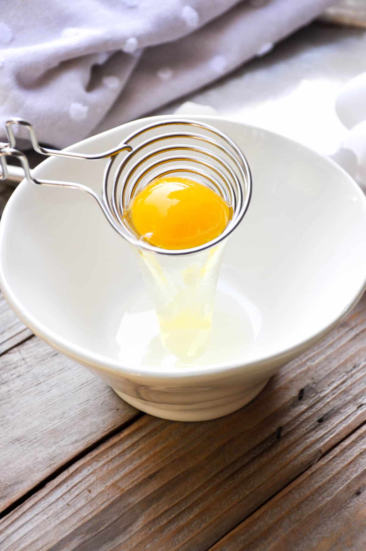 Separate egg white from yoke 