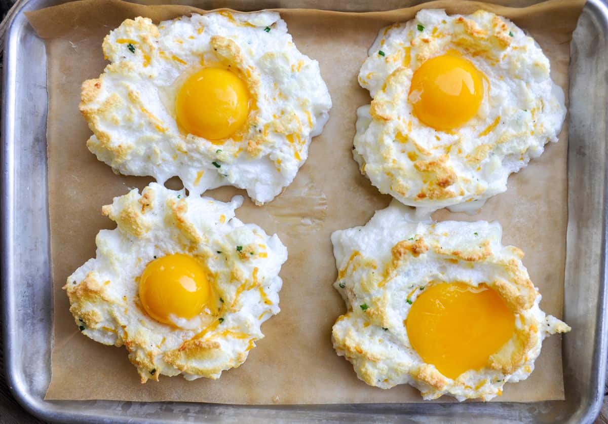 Add egg yoke over baked egg whites and bake for an additional 2-3 minutes