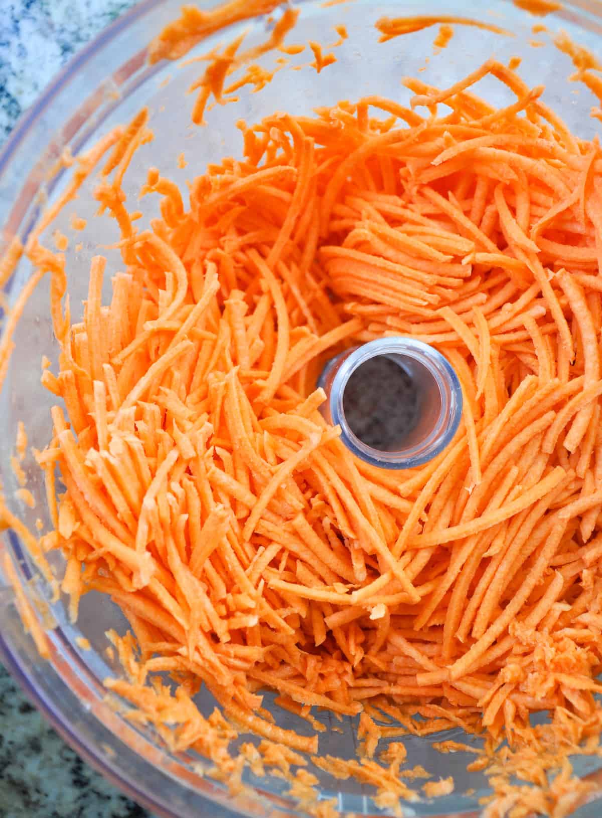Shred sweetpotato with grater or food processor 