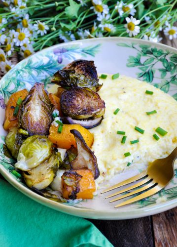 Roasted Winter Vegetables with Creamy Polenta in bowl with fork