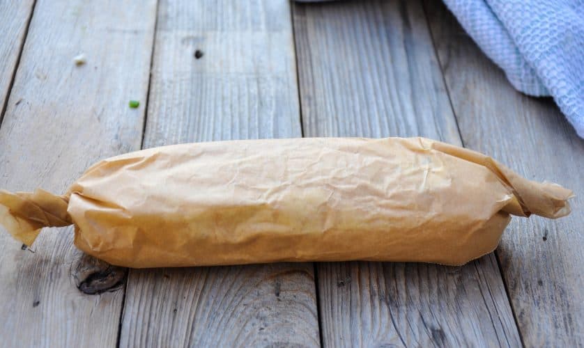 A log of blue cheese butter wrapped inside parchment and twisted at the ends. This is perfect to slice and  top our recipe for Cauliflower steaks.