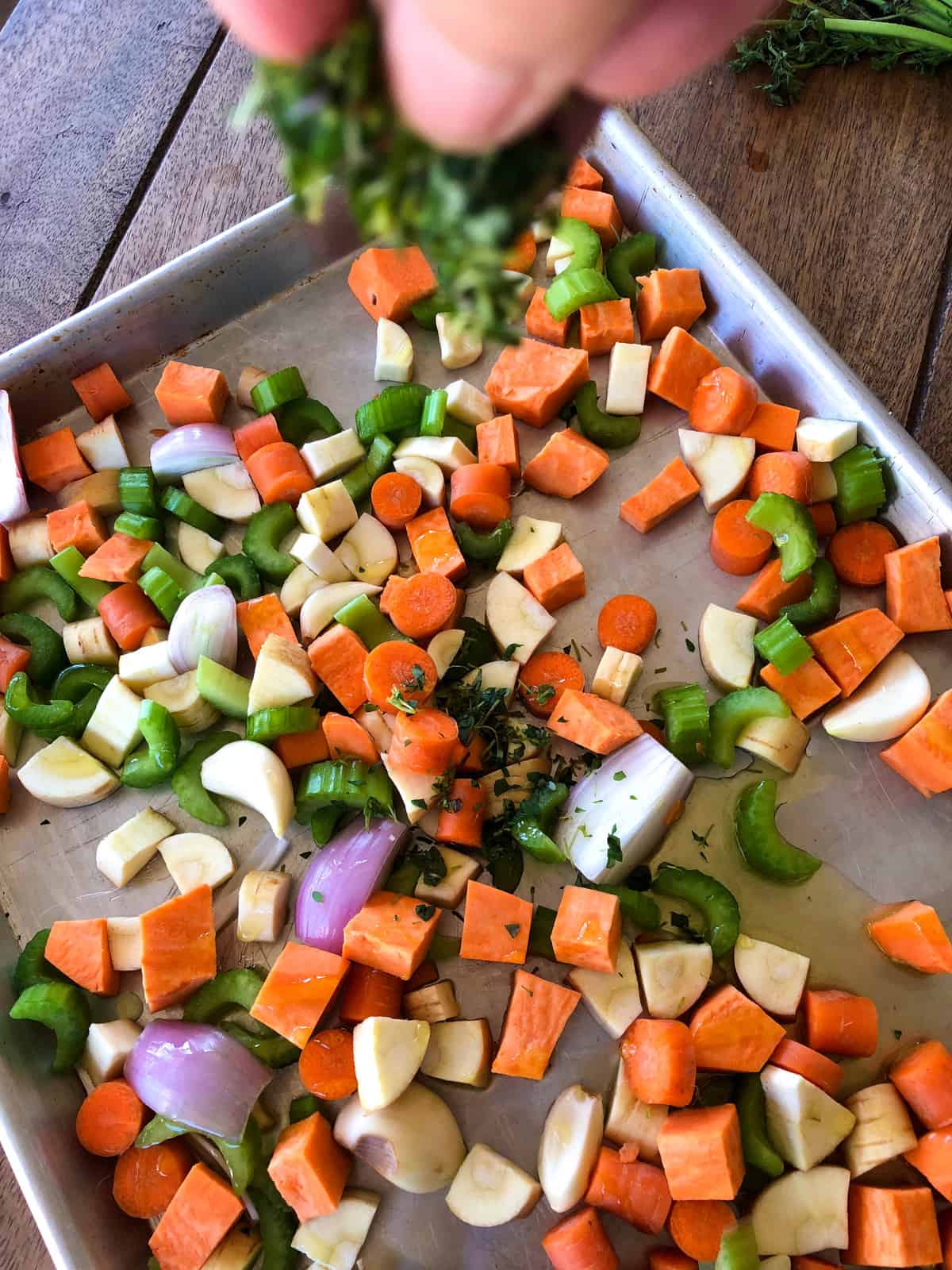 Sprinkle fresh thyme over chopped vegetables