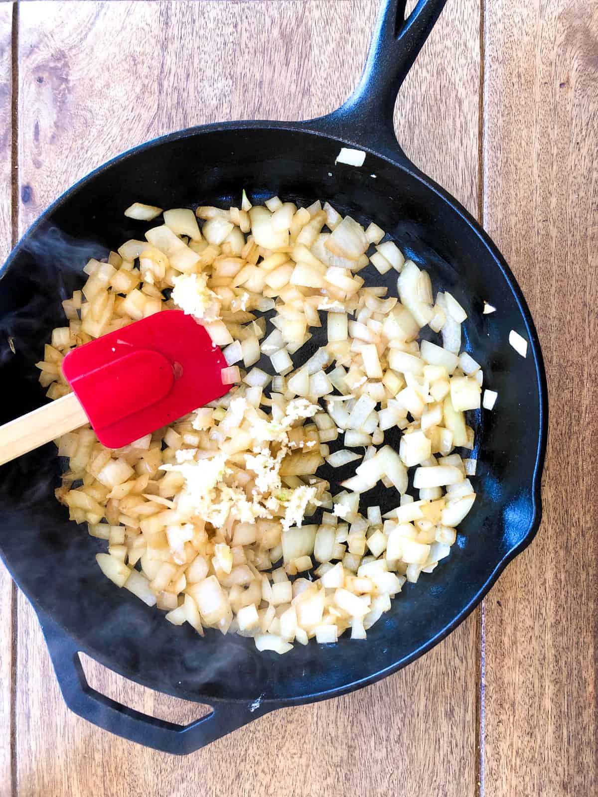 Sauté the onion in a skillet. 