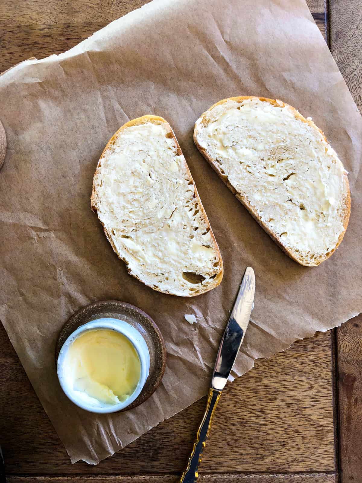 Slather each side of the bread with butter