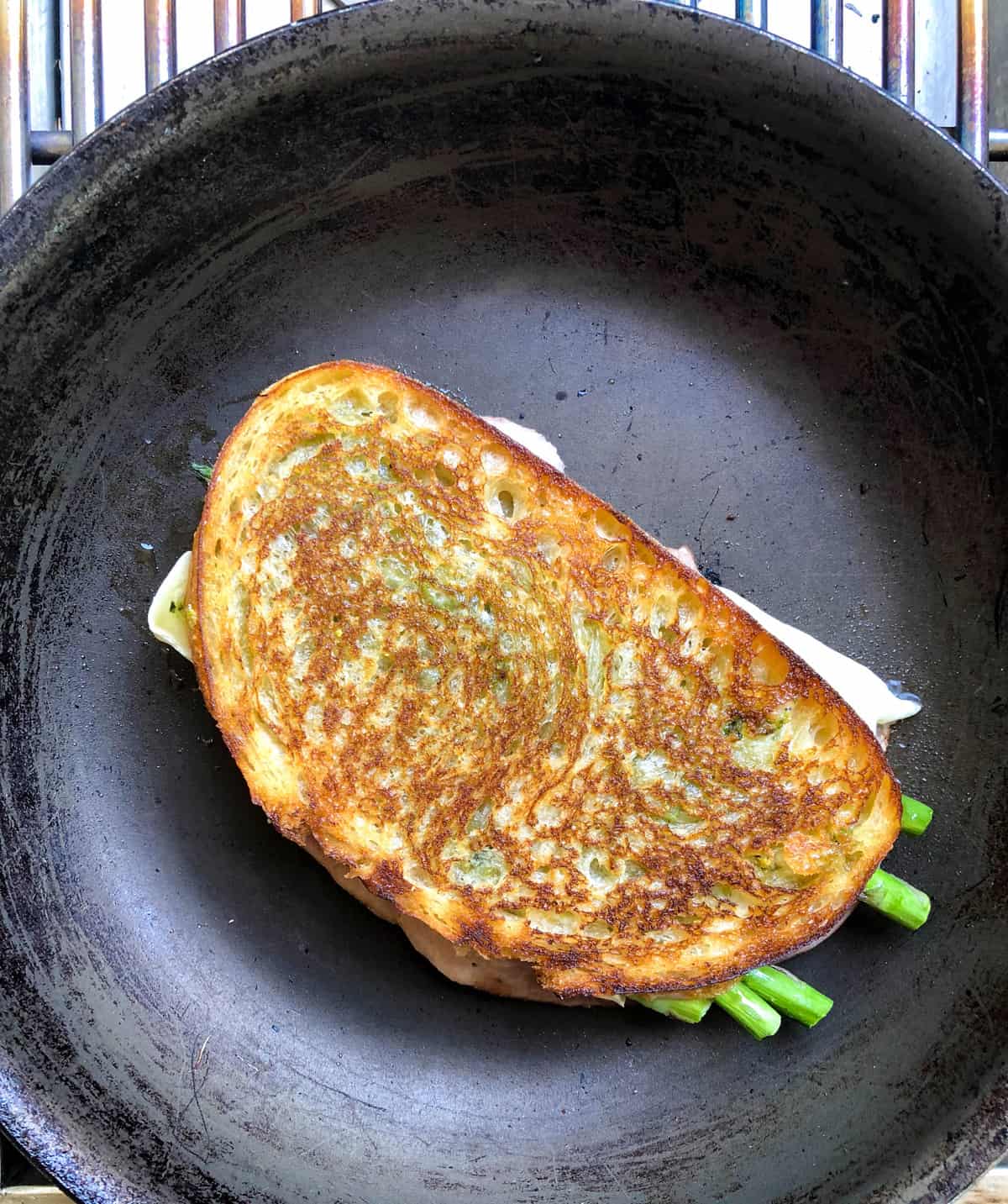 Once the bread is golden, flip and continue to cook until the cheese is melted and the sandwich is hot throughout