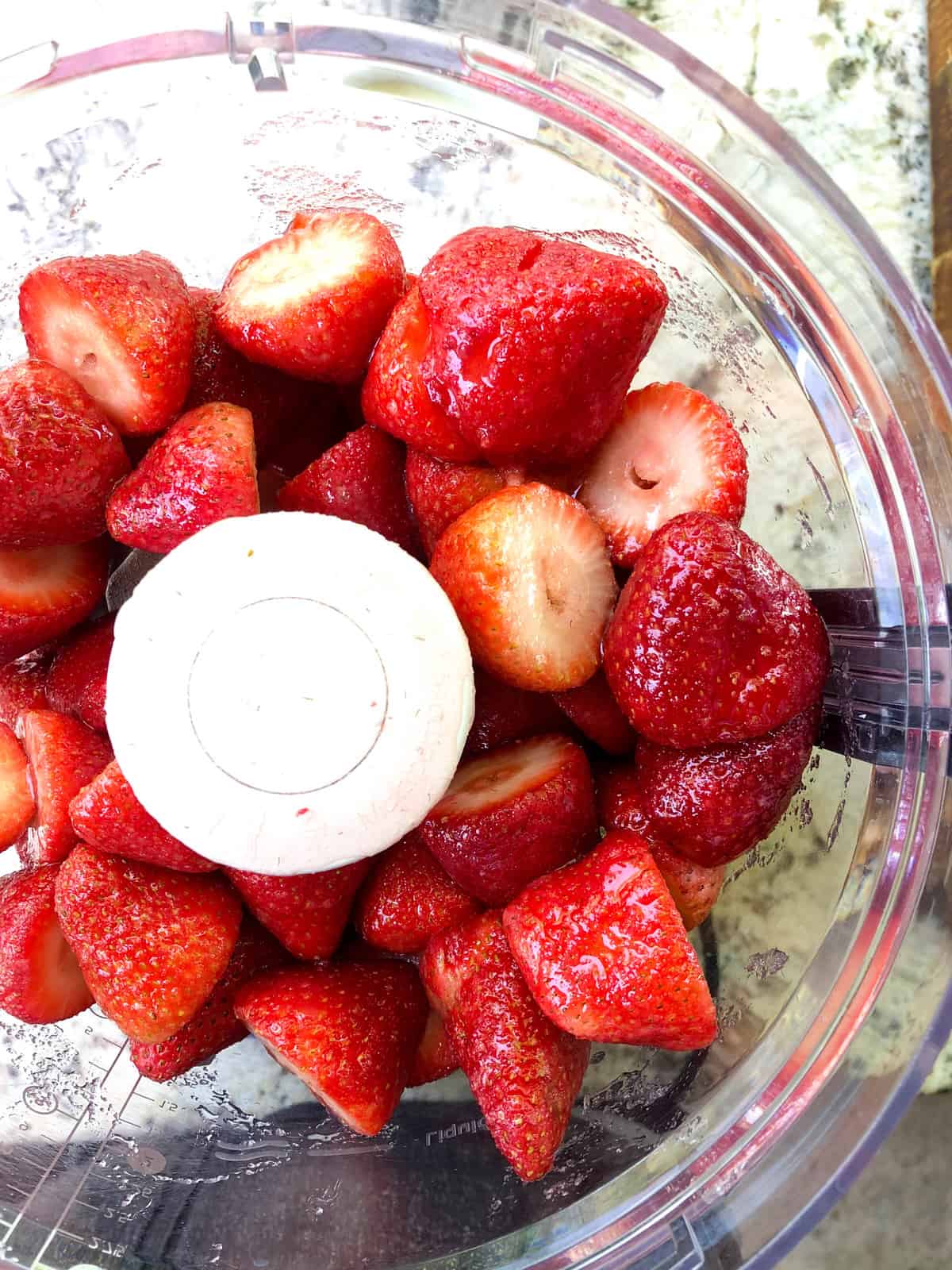 Place the macerated strawberries in a blender or food processor and mix to combine.  Add in fresh lime juice.