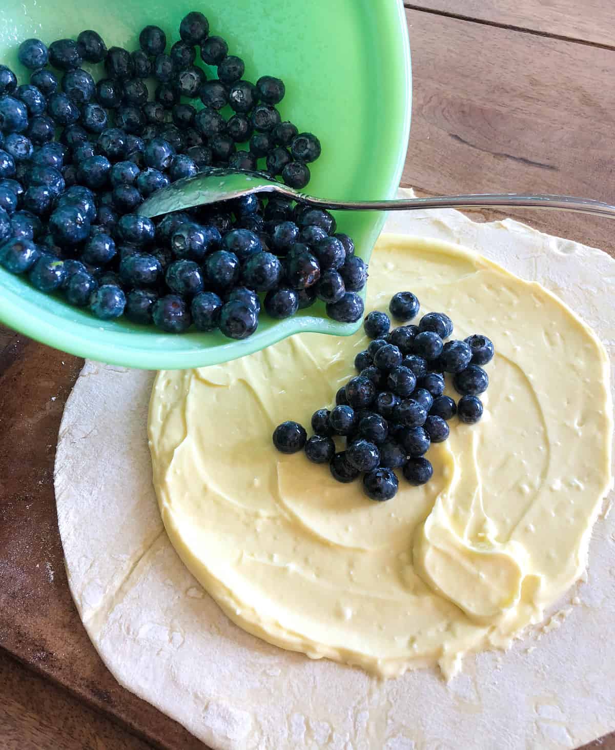 Add the blueberry mixture to the top of the cream cheese filling.