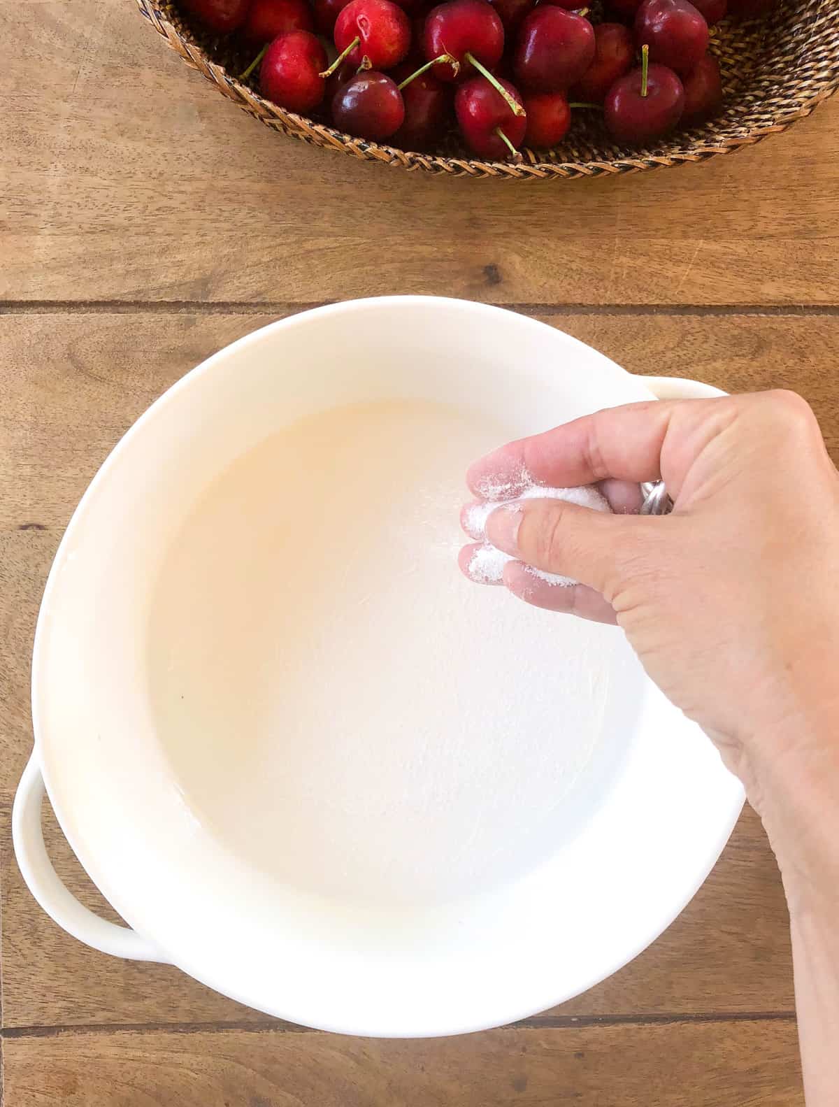 Butter and sugar a round baking dish.