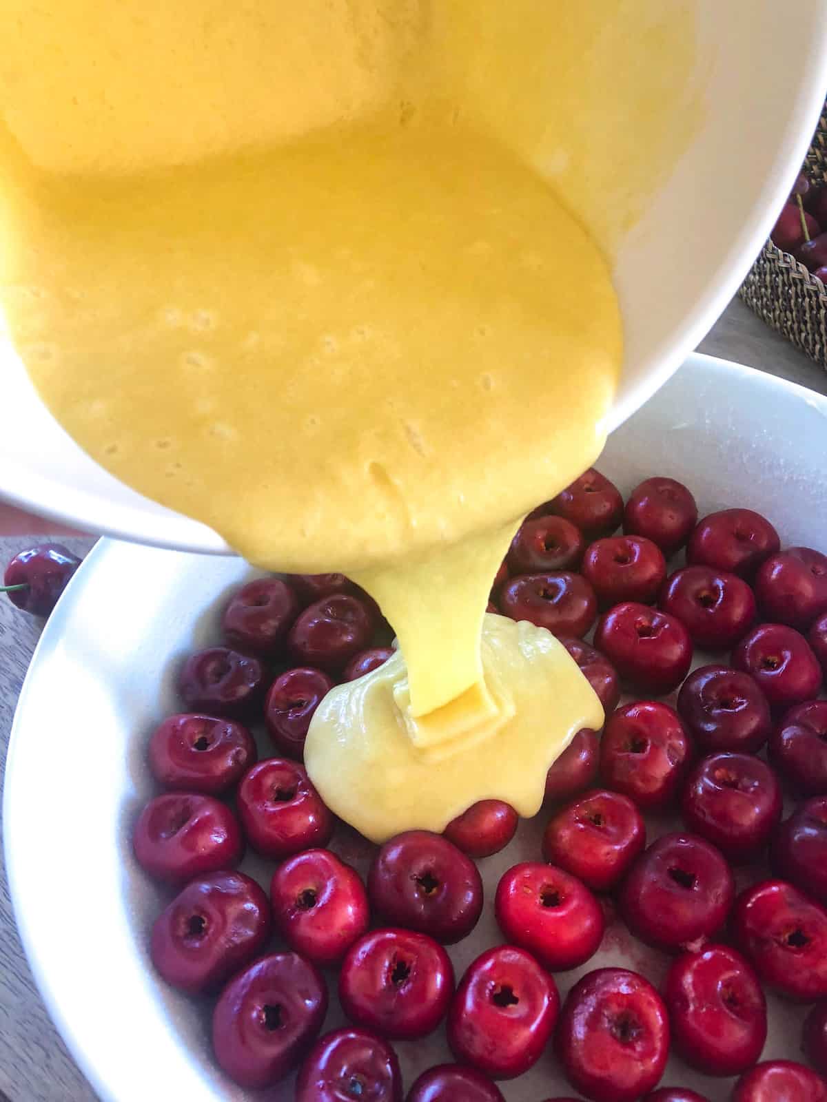 Pour the simple batter (made from eggs, sugar, flour, butter and extract) over the cherries  bake for about 45 minutes