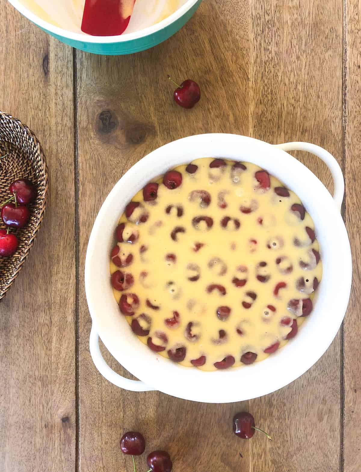 Pour the simple batter (made from eggs, sugar, flour, butter and extract) over the cherries  bake for about 45 minutes