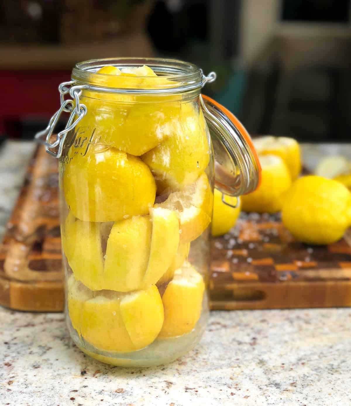 place all the lemons in a clean jar and push down to get them squished in.