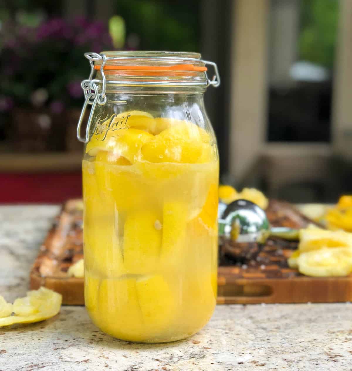 Juice a few more lemons, or add store bought lemon juice to bring the liquid level to the top of the lemons.