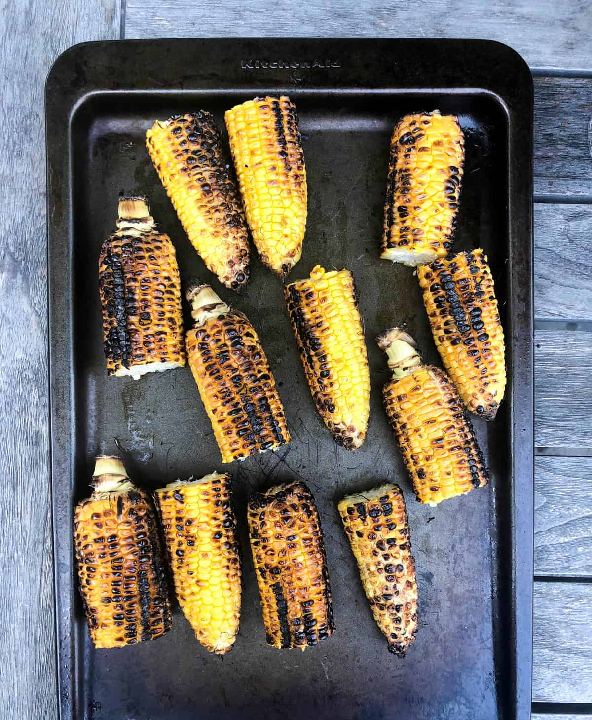Grill the shucked corn and cut in half.