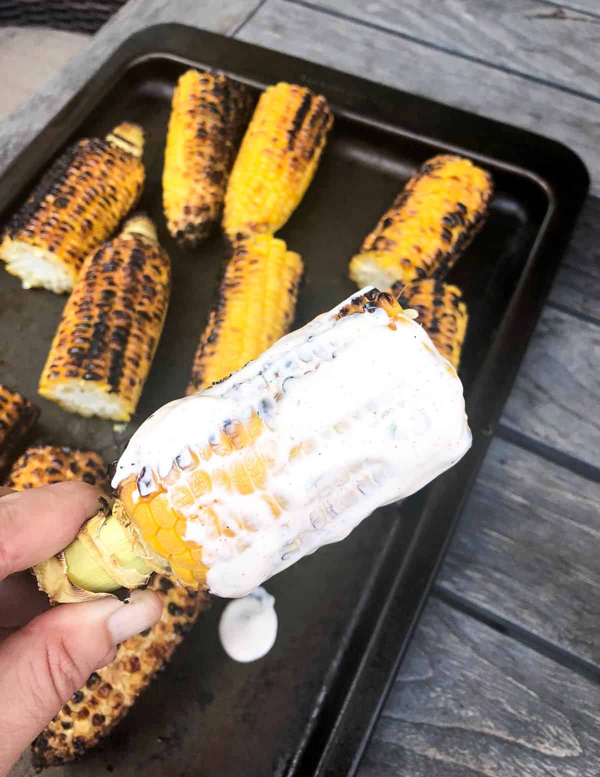 Slather the corn with the jalapeno chili mayo.