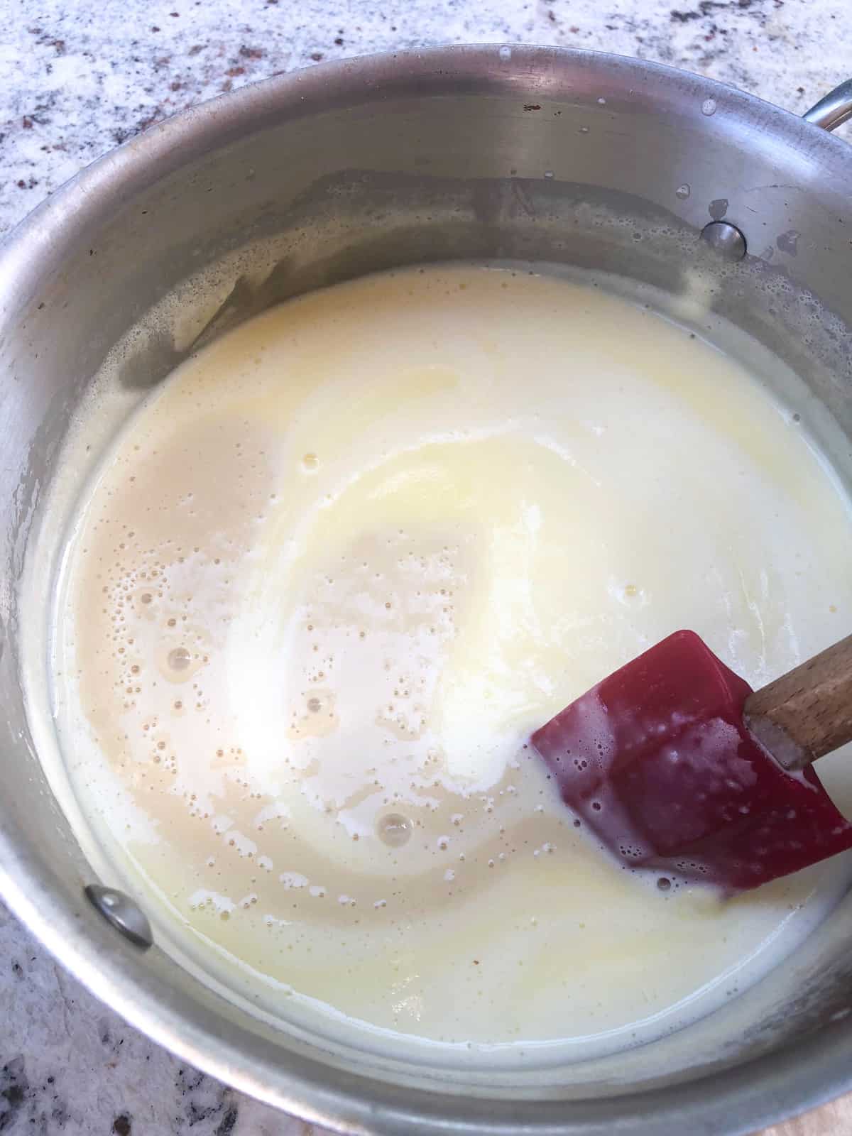 Pour the garlic mixture into the saucepan and heat through. 