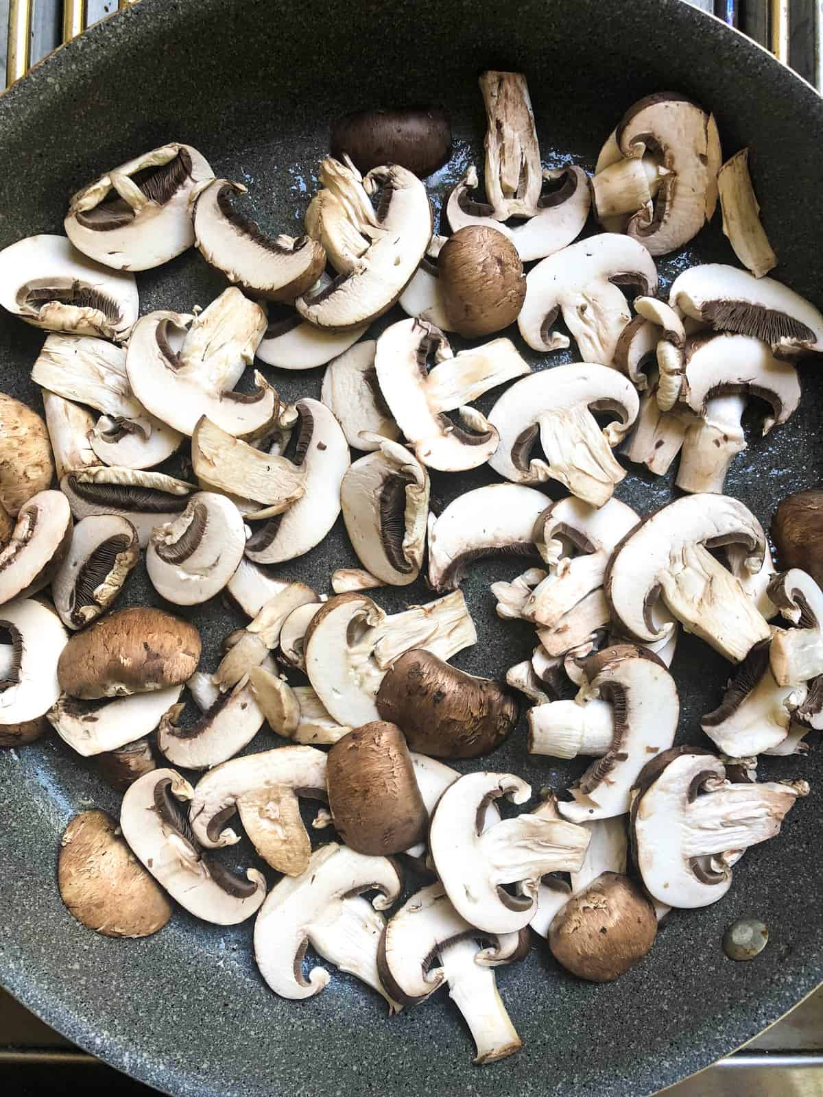 Thick-slice the mushrooms and place them in the pan, stirring until browned about 5-8 minutes.