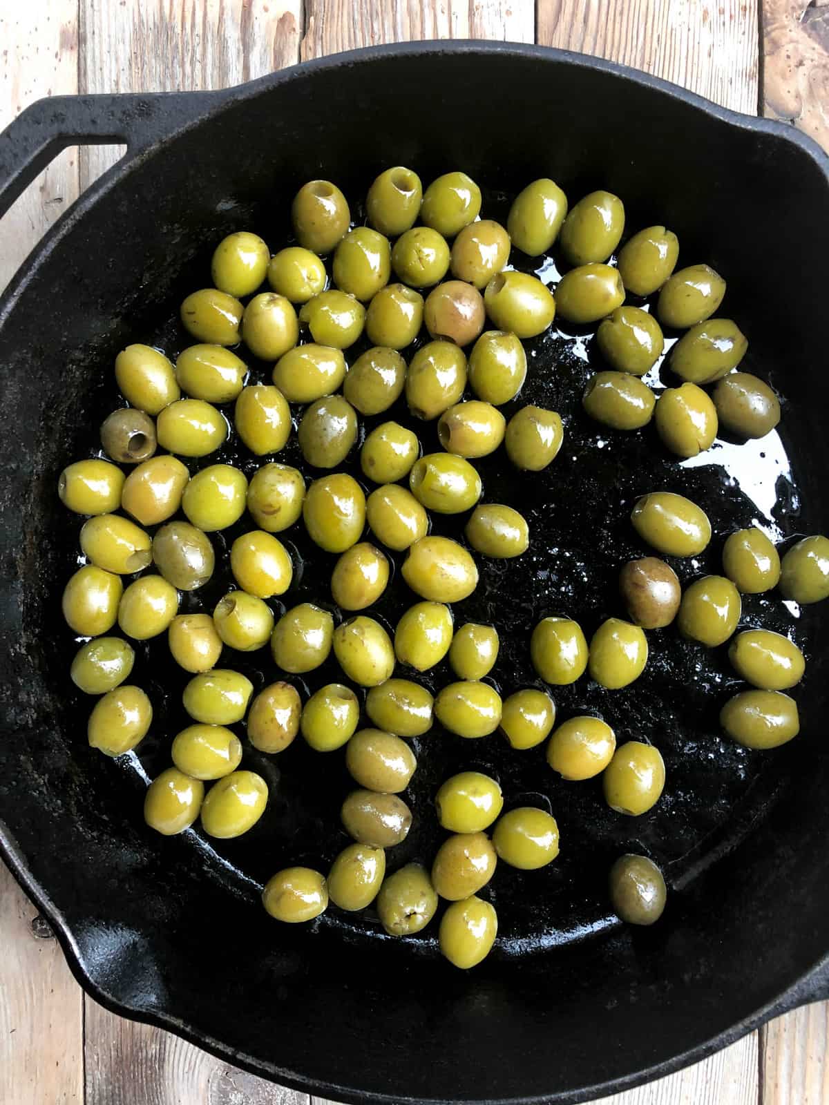Pour in the drained olives.