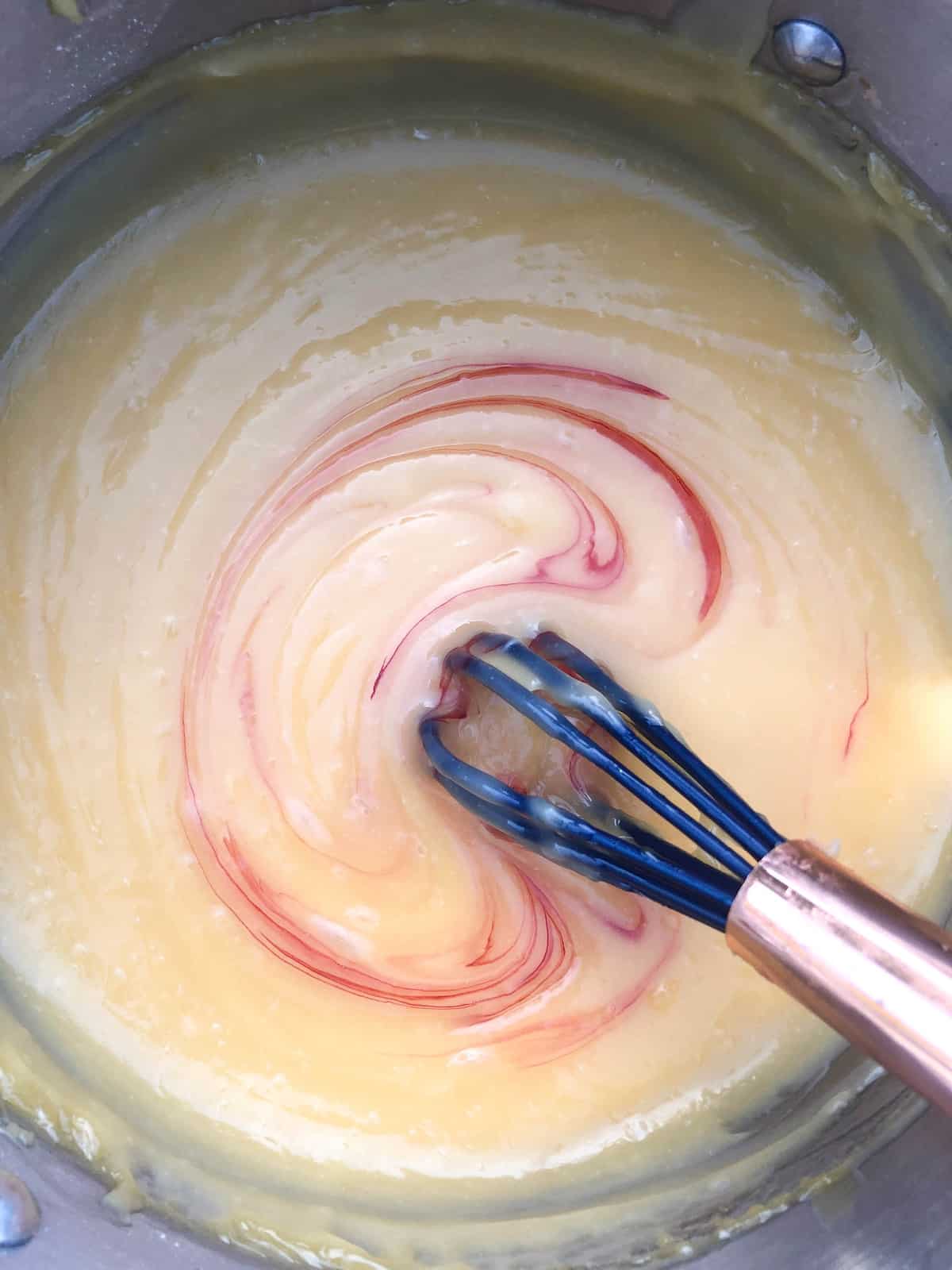 Add red food coloring to make the curd look more grapefruit colored