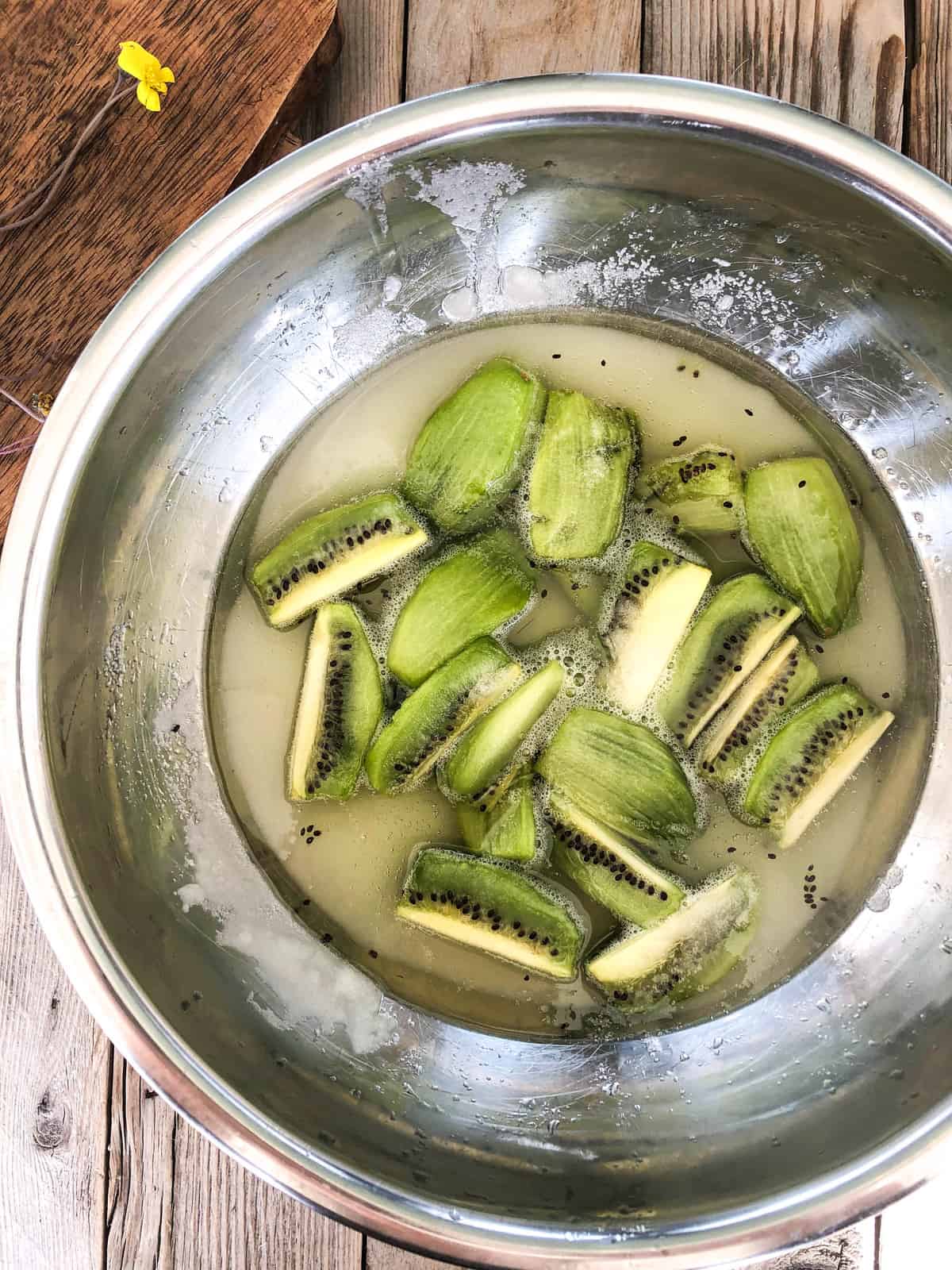 The next day, remove from the fridge and you will see a nice kiwi syrup has been created