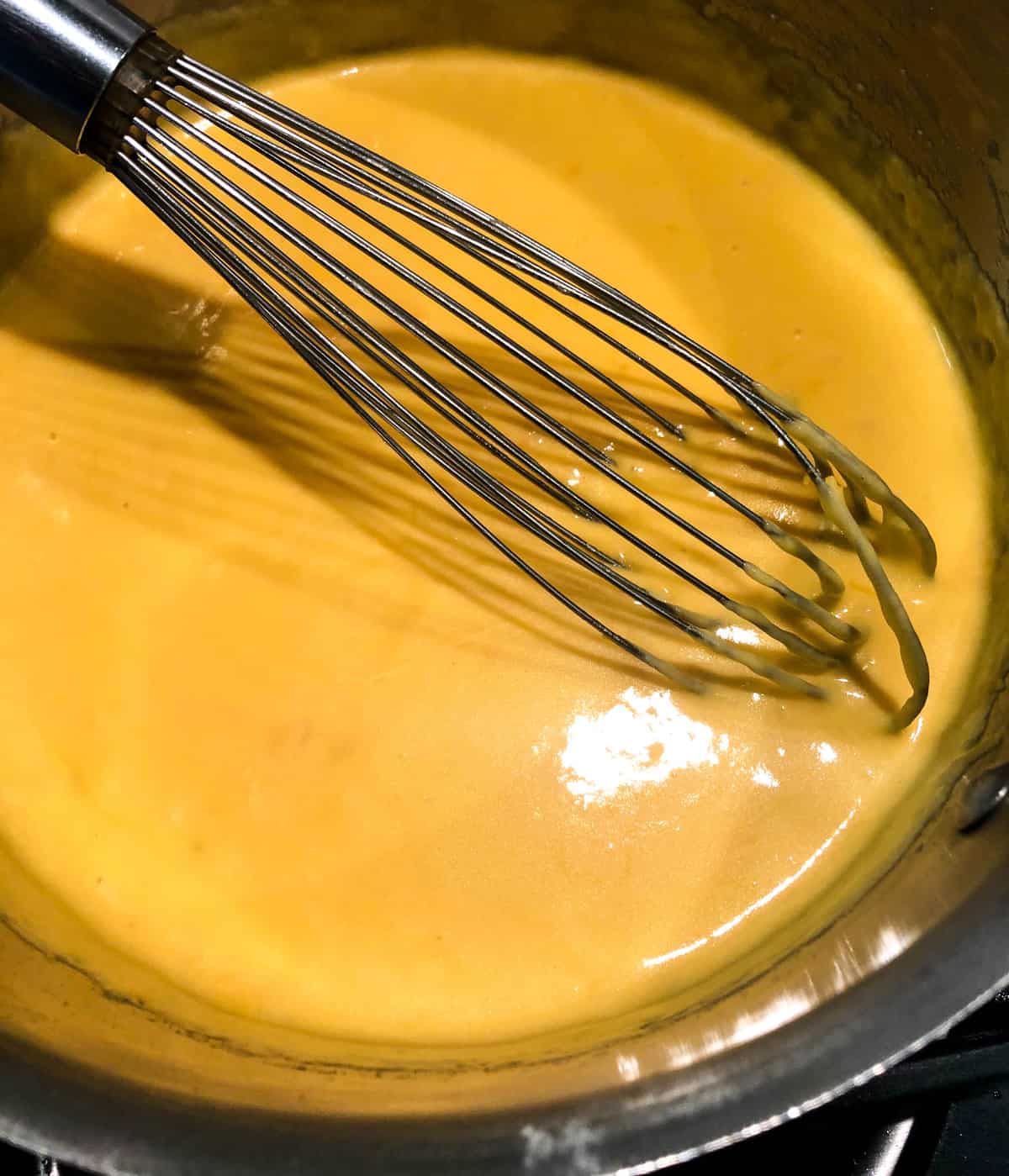 Keep warm by adding the fondue to a warmed fondue pot over a flame