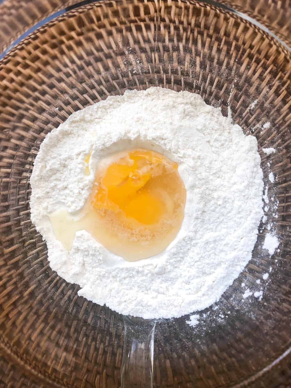 add flour to a bowl and whisk in eggs