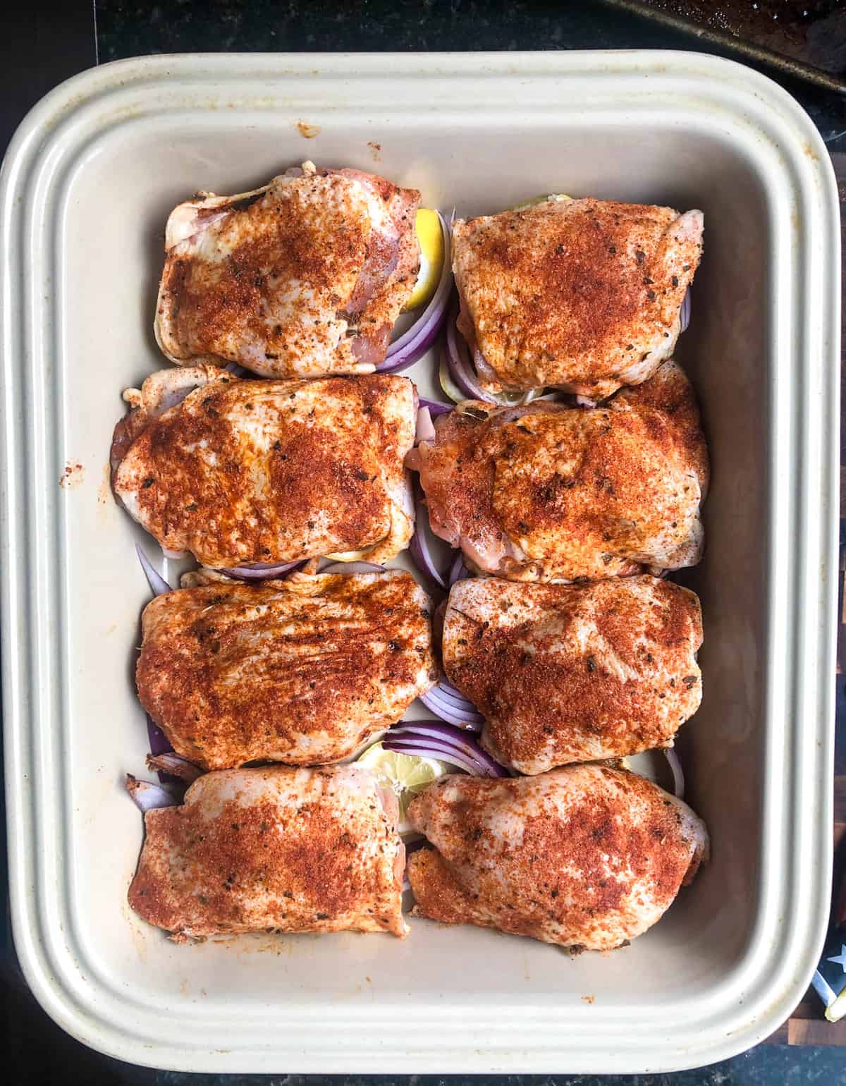 Top with the chicken thighs and bake for 40 minutes, basting once after 20 minutes. 