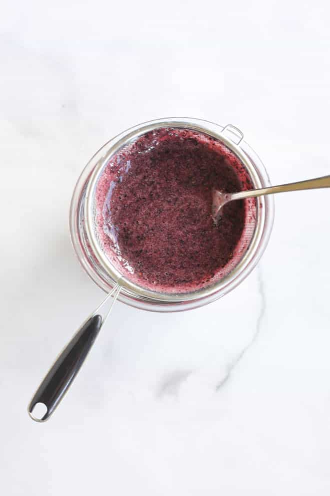 Use a sieve to strain out some of the blueberry skins