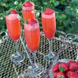 four strawberry spritzer cocktails on a table
