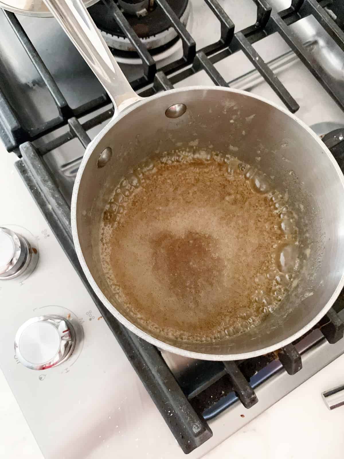 making the caramel for apples