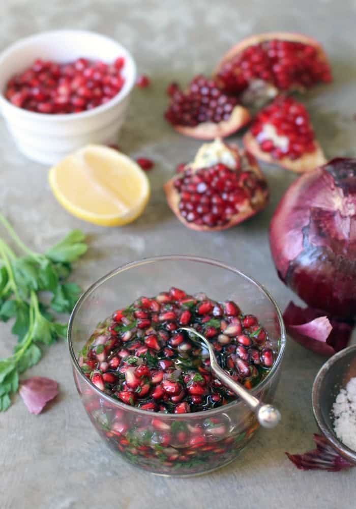 pomegranate salsa in a clear glass bowl