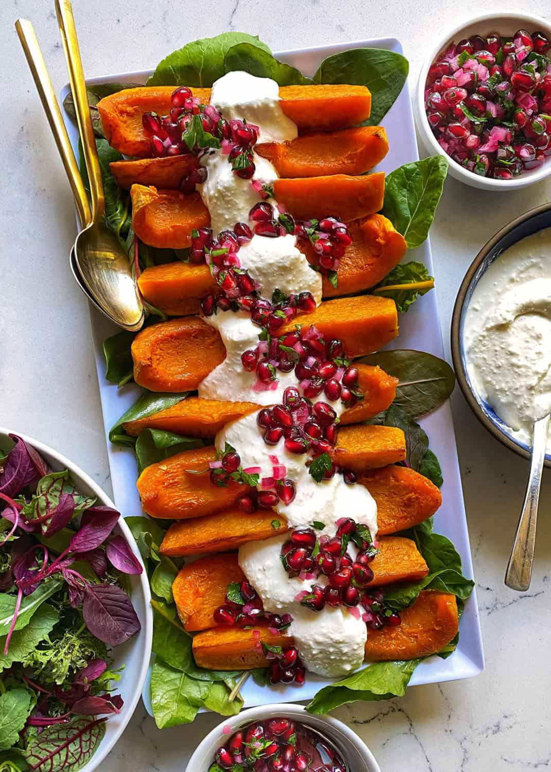 roasted sweet potatoes with feta and pomegranate seeds