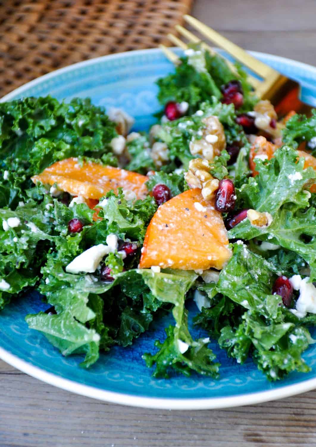 Kale Salad with persimmons, pomegranates and leafy greens