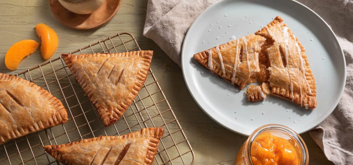 Cling Cling Peach Pop Tarts on a cooling rack and serving plate.