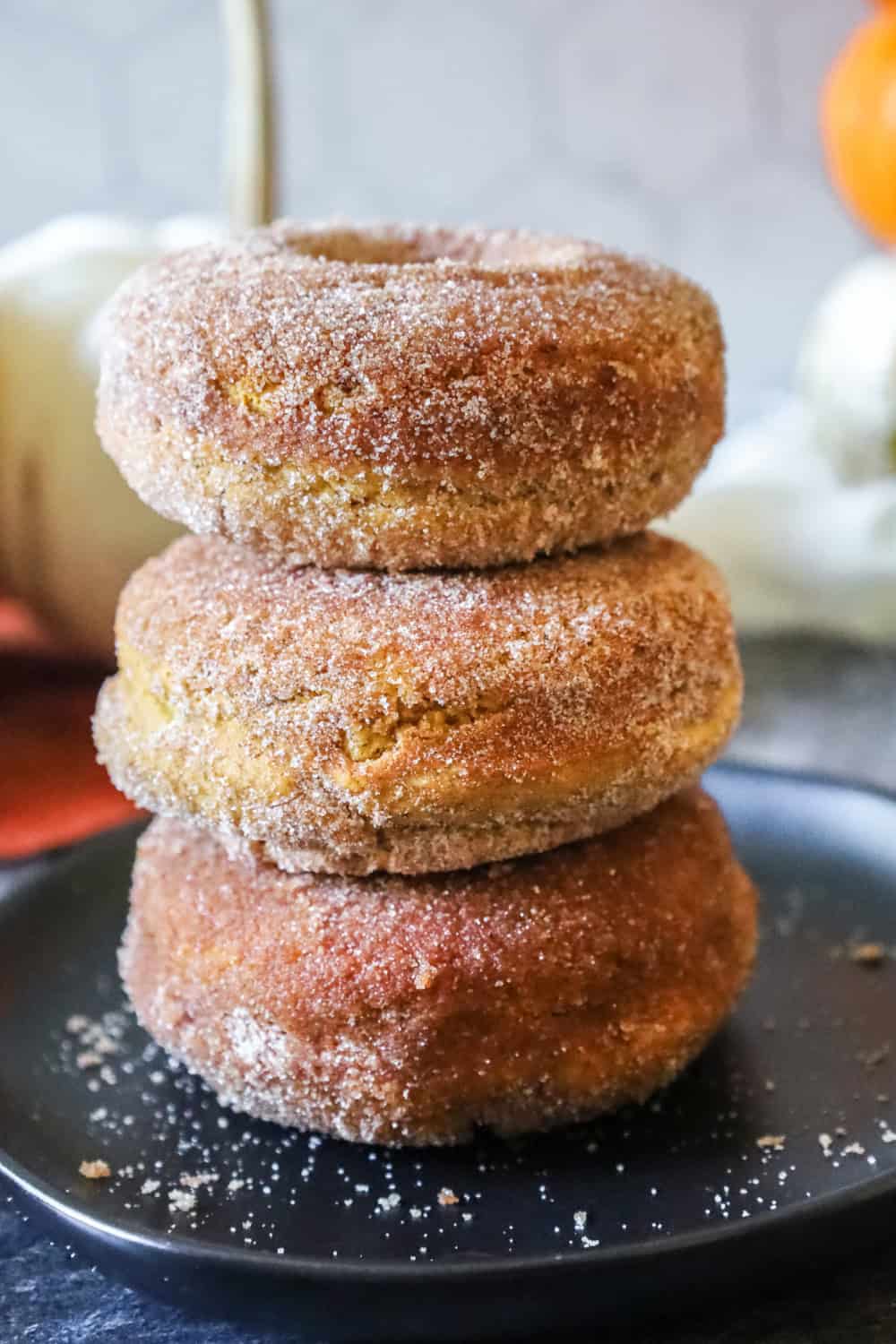 stack of gluten free pumpkin spice doughnuts