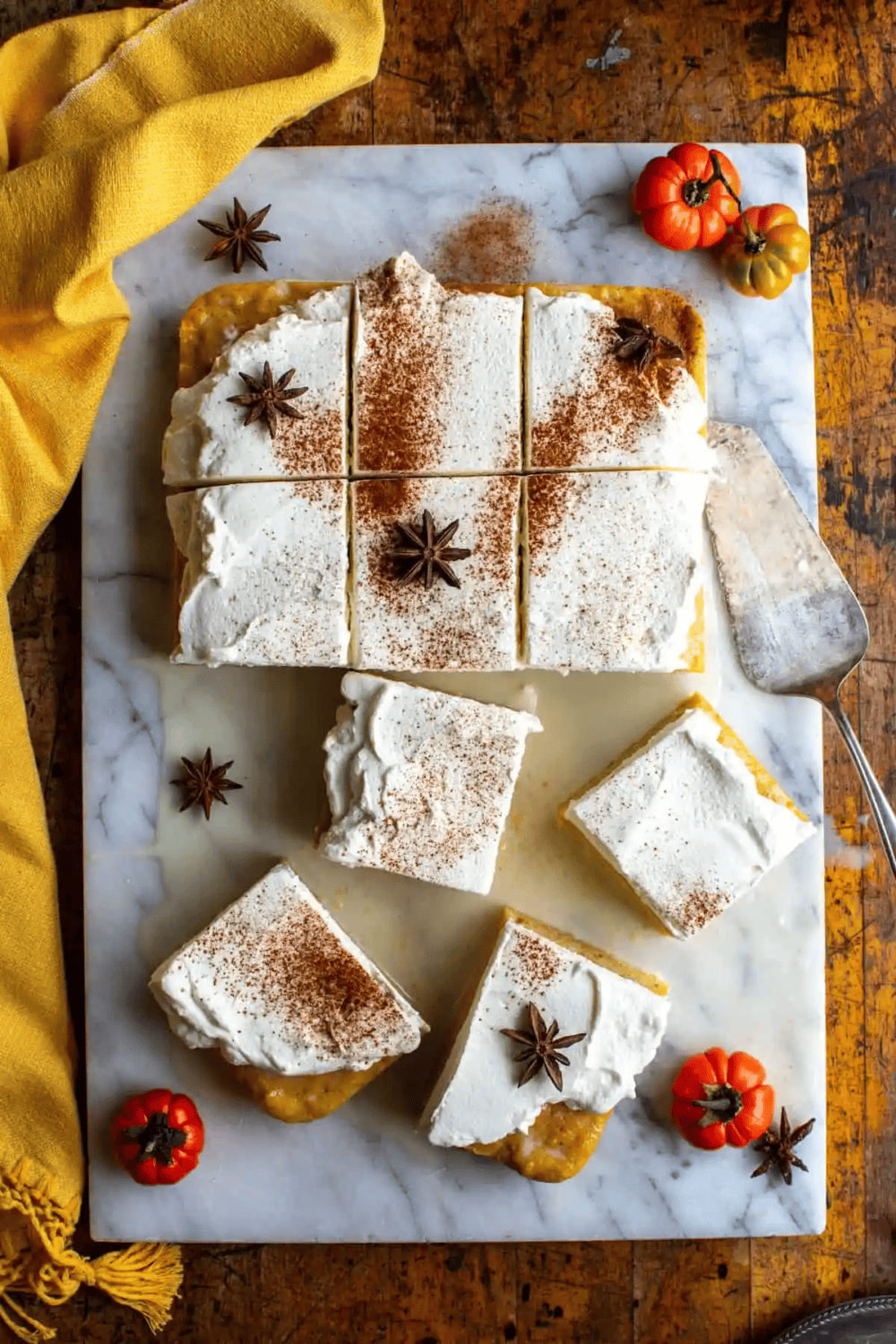 pumpkin sheet cake on a white marble slab