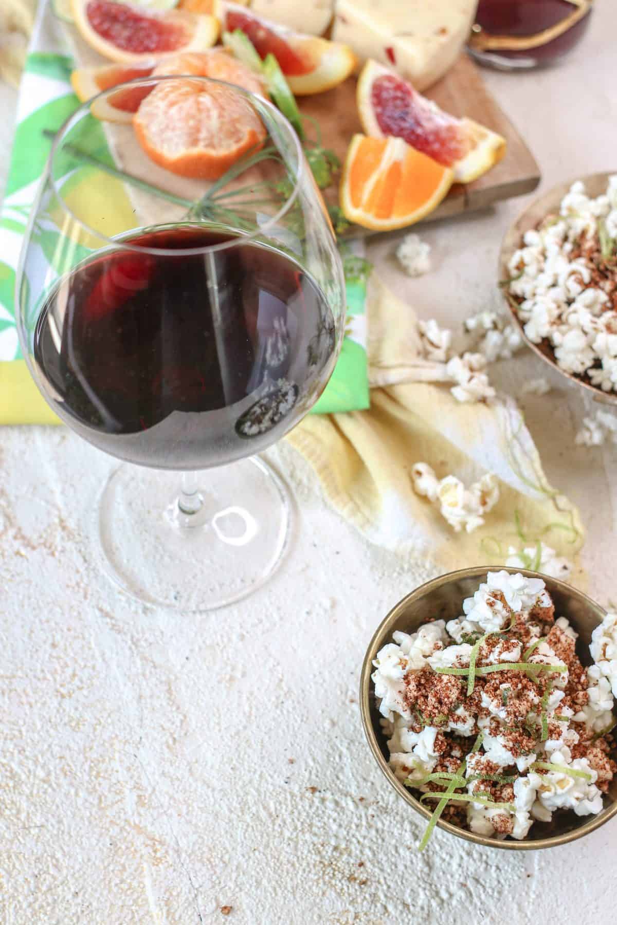 Spicy Cotija Popcorn with a glass of California Zinfandel