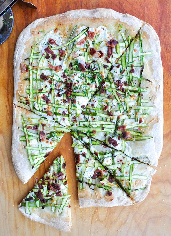 A whole Asparagus Ribbon Pizza sliced for serving. 