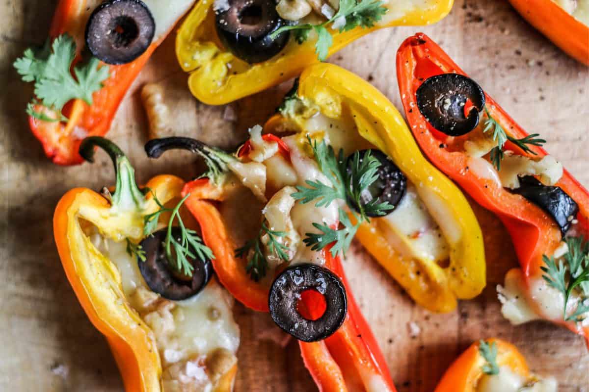 Mini Stuffed Peppers Recipe with Olives and Pepper Jack Cheese close up of colorful stuffed peppers