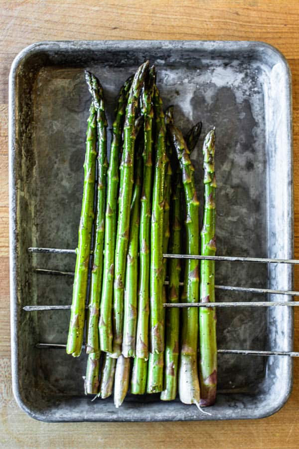 Asparagus prepared for grilling.