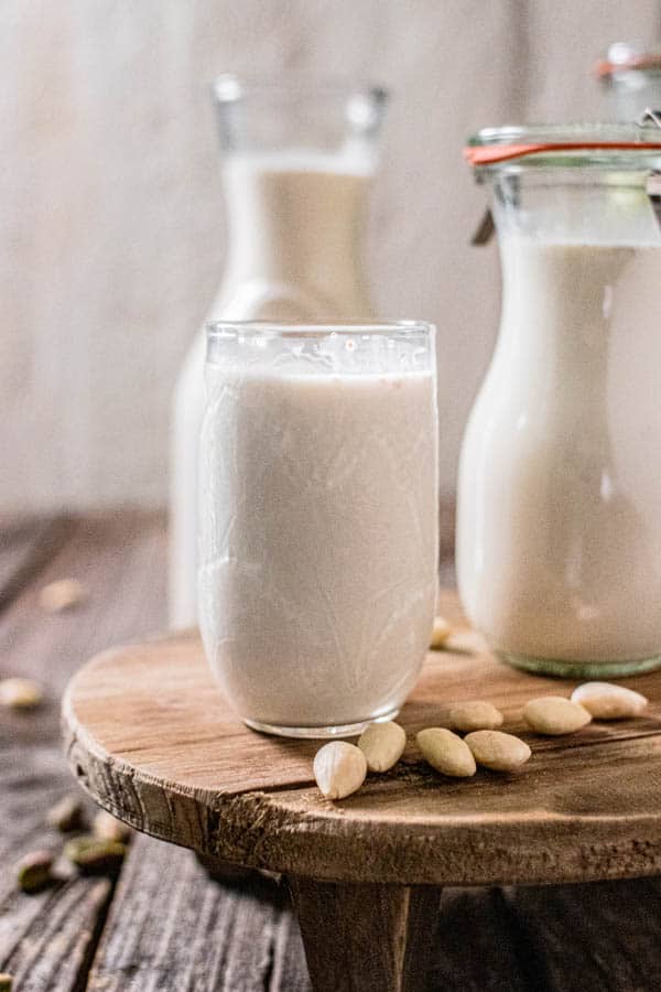 Glasses and carafes of almond milk.