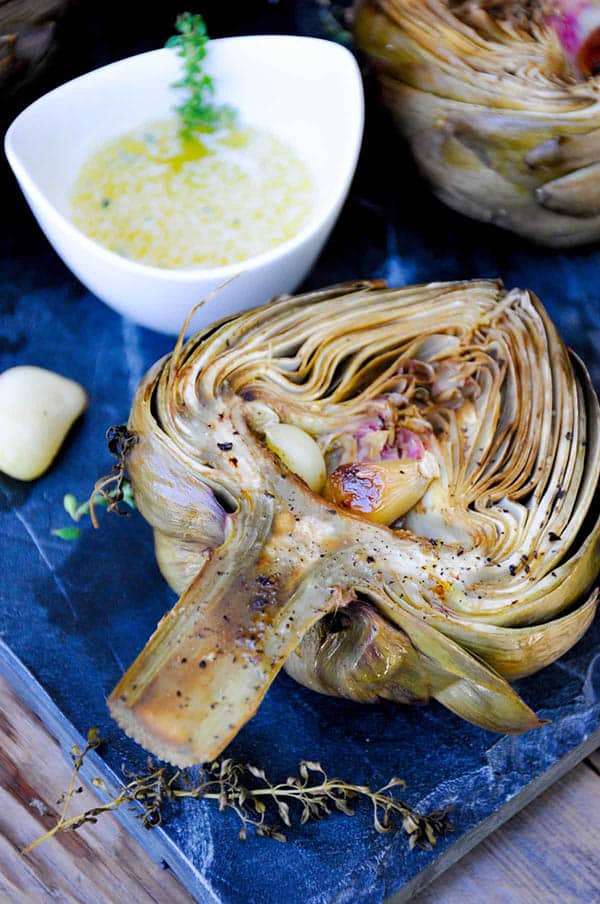 How to cook roasted artichokes with garlic and herbs.